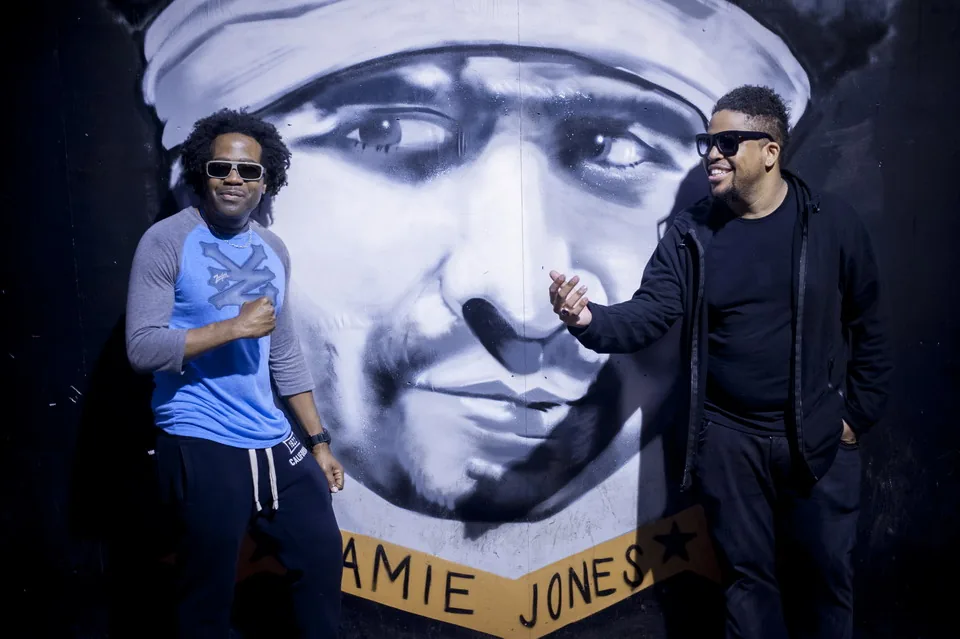 DJ Pierre, left, and Felix Da Housecat standing in front of a painted mural in 2013