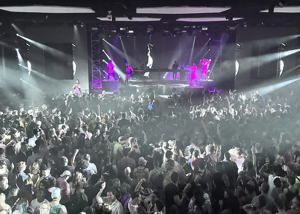The crowd at Echostage in Washington, DC in front of a lit stage and LED walls