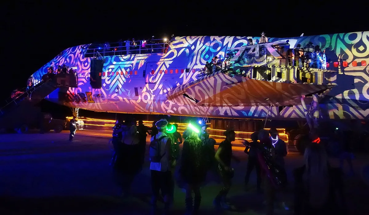 The 747 art car, a Boeing 747 fuselage converted into a mutant vehicle, on the playa at Burning Man