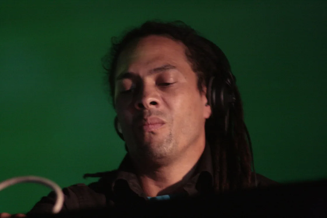 Roni Size performing behind a mixer at the Astropolis festival in 2009