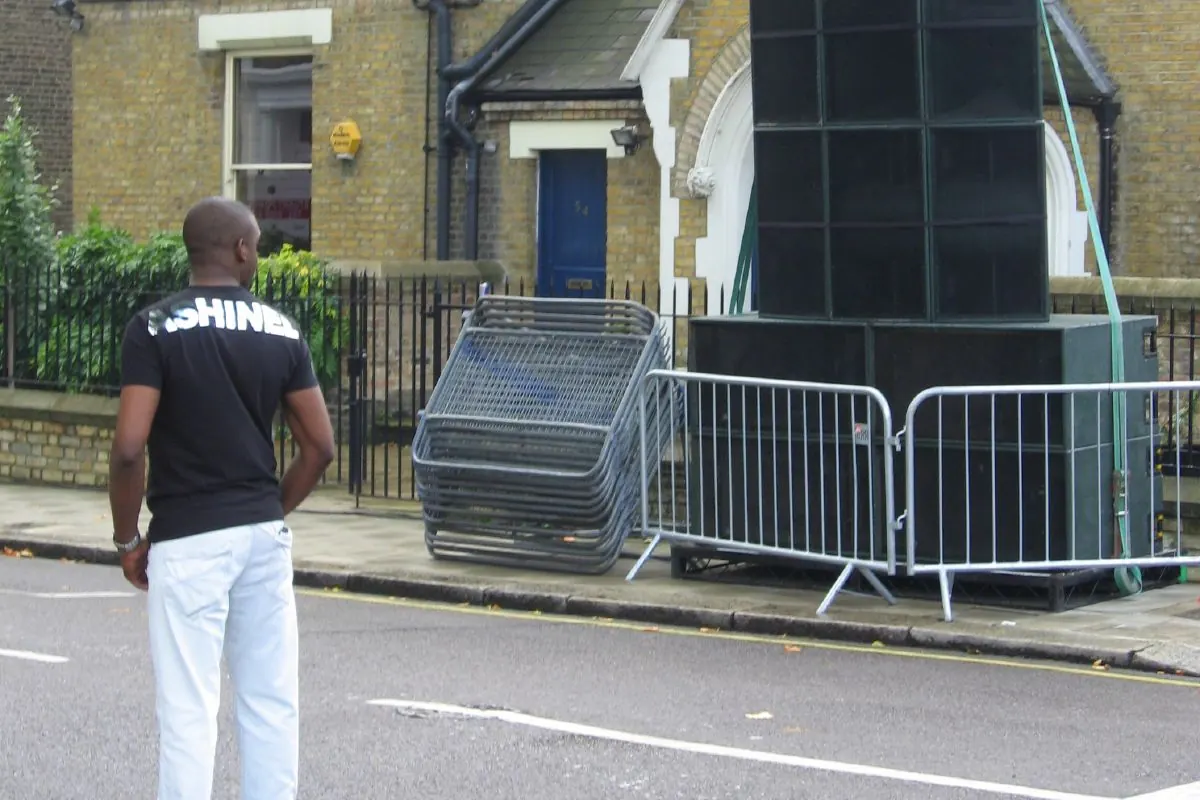 A hand-built speaker stack towering over the street at Notting Hill Carnival