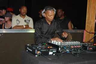 Jeff Mills mixing records in a Detroit club in 2010