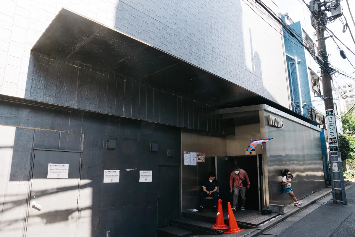 The street-level entrance and signage of WOMB nightclub in Shibuya, Tokyo