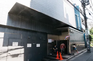 The street-level entrance and signage of WOMB nightclub in Shibuya, Tokyo