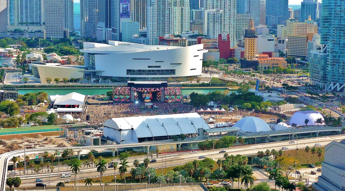 An aerial view of Ultra at Bicentennial Park in 2011, a packed crowd in front of the Main Stage with downtown Miami towers behind