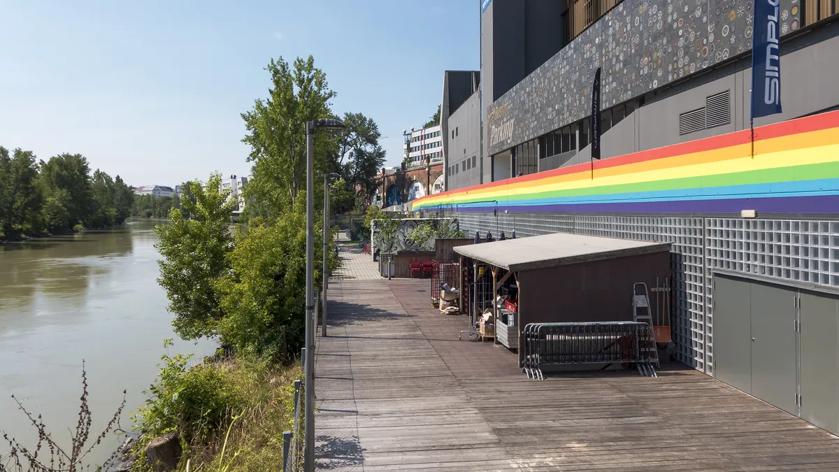The Grelle Forelle building on the Spittelauer Lände by the Donaukanal in Vienna, with a rainbow stripe on its facade
